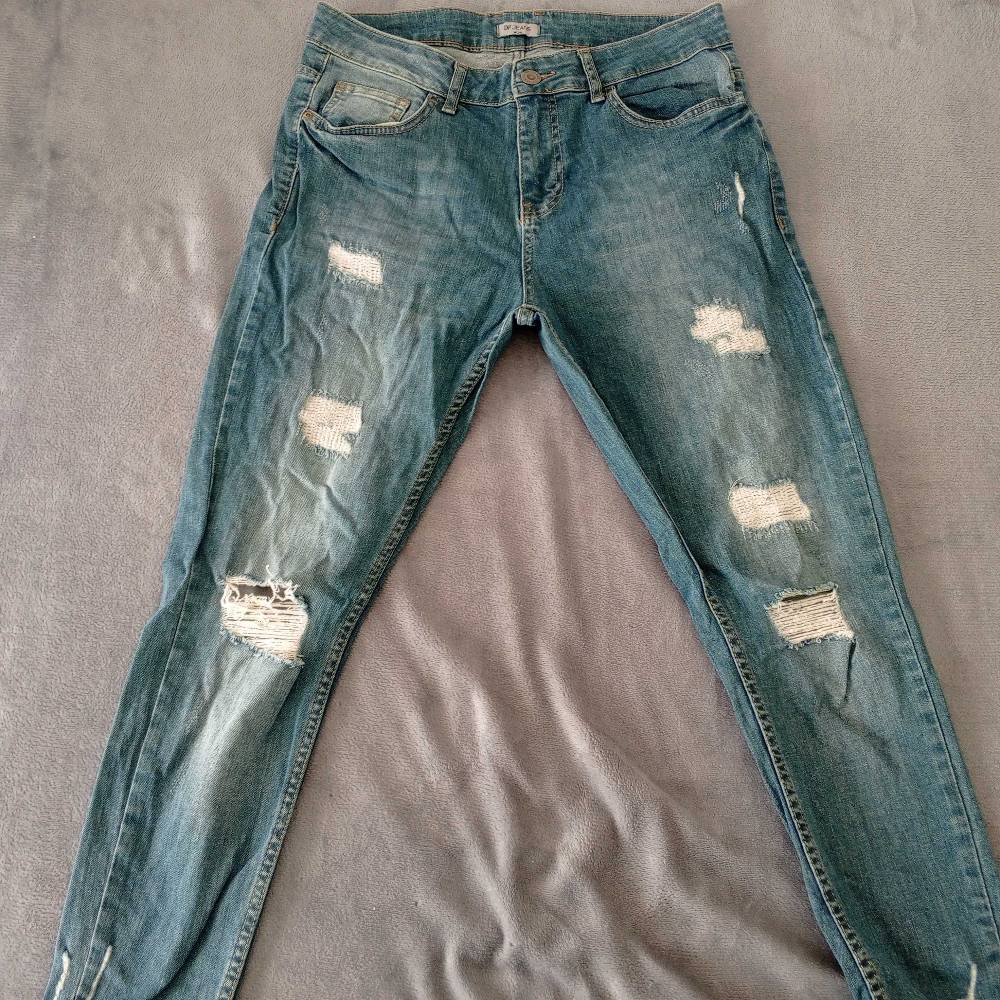 Distressed Slim Fit Denim Jeans